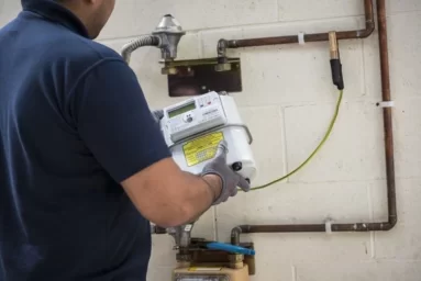 Engineer installing gas meter