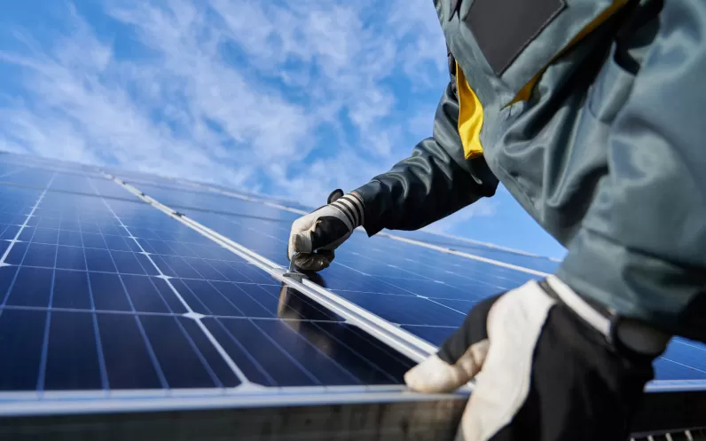 Engineer installing solar panel