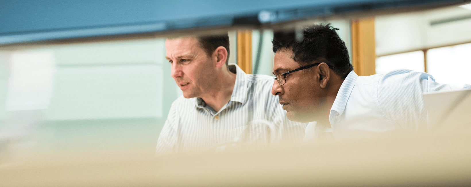 Two male colleagues working together