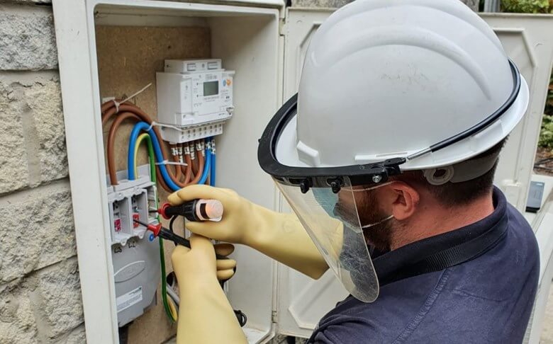 man fixing smart meter