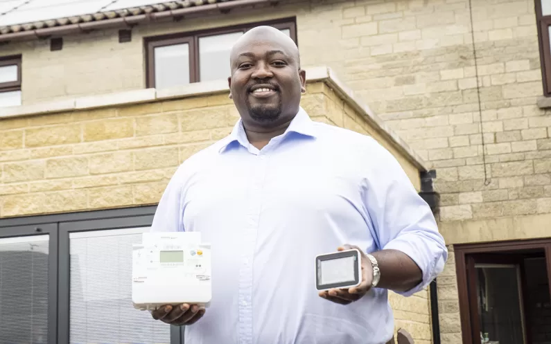 Customer holding smart meter