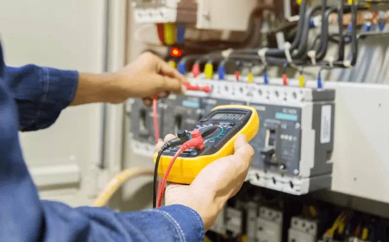 Close up of engineer testing electrics