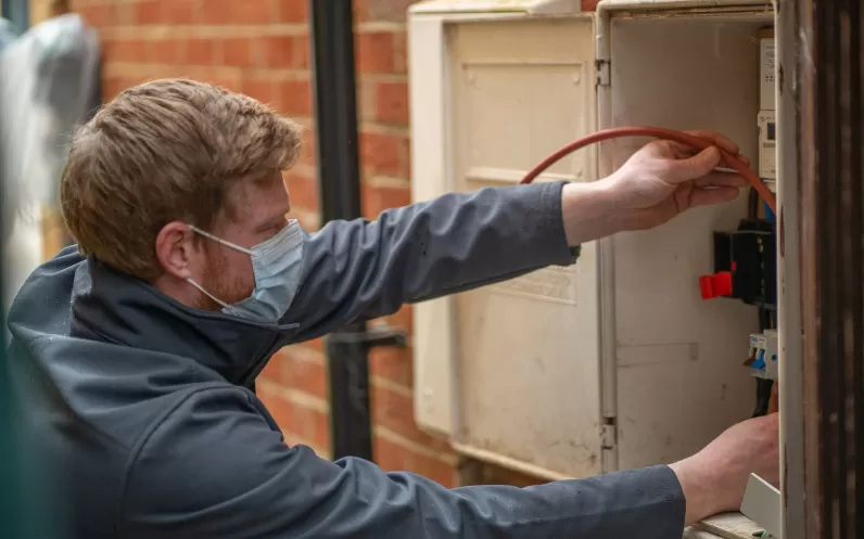 Image showing an SMS engineer installing a smart meter