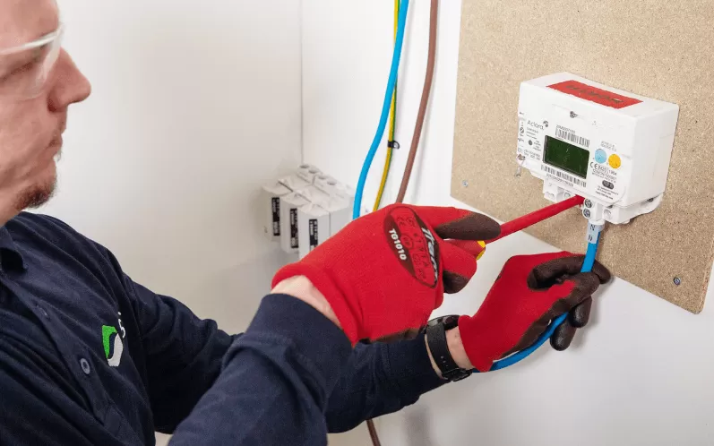 Engineer fitting a meter