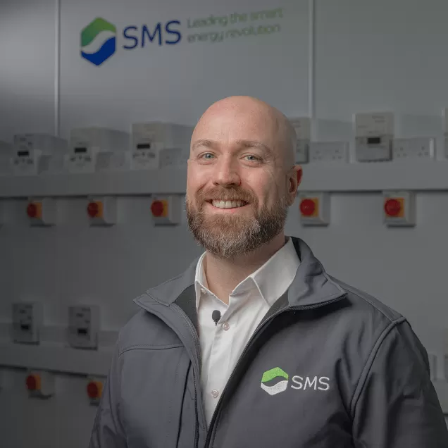 Smiling SMS worker