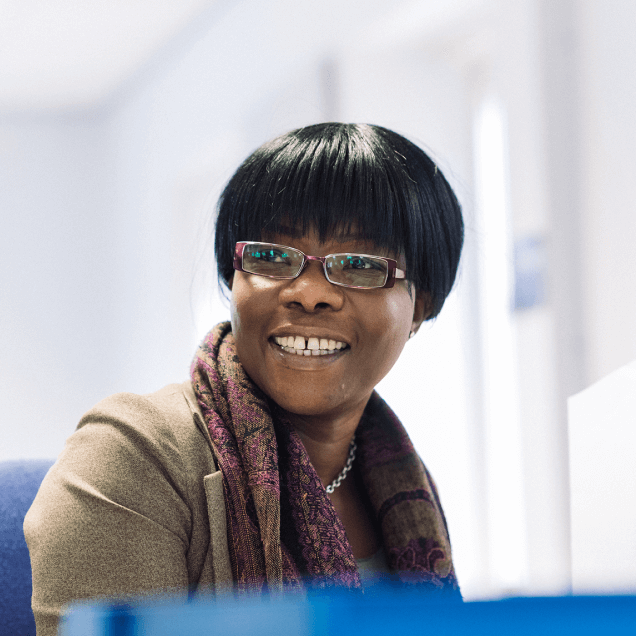 SMS worker smiling
