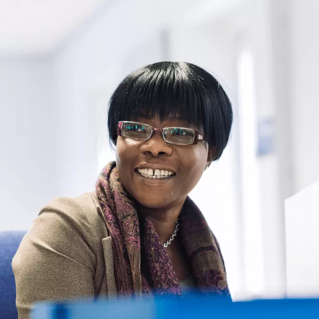 SMS worker smiling