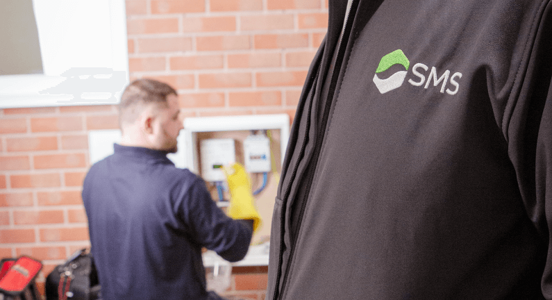 Engineer fitting smart meter