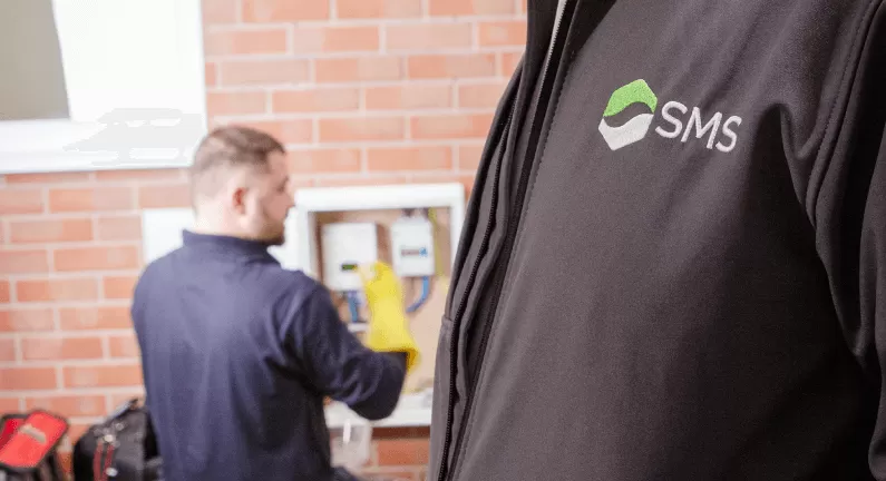 Engineer fitting smart meter