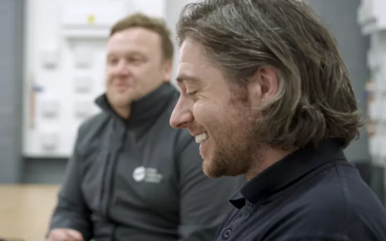 image showing two SMS workers smiling