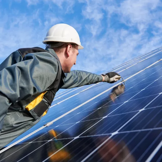 Engineer installing solar panel
