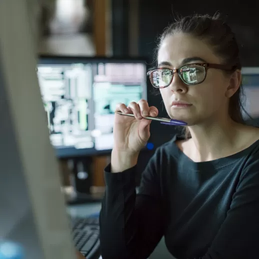 woman sitting infront of a screen